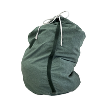 Load image into Gallery viewer, A green hemp laundry duffle bag with a drawstring closure and a wide shoulder strap.